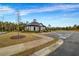 Community center featuring beautiful landscaping, trees and a convenient parking area at 787 Milo Bay Street, Loganville, GA 30052