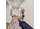 Inviting hallway with wood floors, leading to a naturally lit living space at 787 Milo Bay Street, Loganville, GA 30052