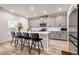 Modern kitchen with gray cabinets, white countertops, and stainless steel appliances at 787 Milo Bay Street, Loganville, GA 30052