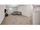 Cozy bonus living area with comfortable seating, plush carpeting, and natural light at 787 Milo Bay Street, Loganville, GA 30052