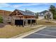 Community mailboxes situated under a wooden pergola structure and convenient parking area at 787 Milo Bay Street, Loganville, GA 30052