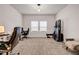 Spacious home office with natural light and plenty of room for working and exercising at 787 Milo Bay Street, Loganville, GA 30052