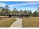 Community playground with swings, a slide, and climbing structure, surrounded by lush greenery at 787 Milo Bay Street, Loganville, GA 30052