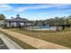 Community pool area with a separate splash pad, a bath house and plenty of seating at 787 Milo Bay Street, Loganville, GA 30052