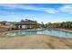 Beautiful community pool with lounge chairs overlooking several homes in the neighborhood at 787 Milo Bay Street, Loganville, GA 30052