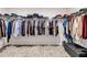 Walk-in closet with ample hanging space and shelving offers organization at 787 Milo Bay Street, Loganville, GA 30052