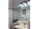 Bathroom with a tub-shower combo, light fixtures, and a countertop at 908 Chippendale Ln, Norcross, GA 30093