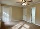 Bedroom with carpeting and standard closet at 908 Chippendale Ln, Norcross, GA 30093