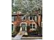 Charming brick townhouse with manicured landscaping and inviting entryway at 908 Chippendale Ln, Norcross, GA 30093