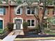 Charming brick townhome with well-manicured landscaping and a welcoming front entrance at 908 Chippendale Ln, Norcross, GA 30093