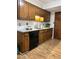 Classic kitchen featuring wood cabinets, sleek appliances, and functional design at 908 Chippendale Ln, Norcross, GA 30093