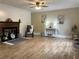 Cozy living room with a fireplace, hardwood floors, and stylish decor at 908 Chippendale Ln, Norcross, GA 30093