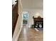 Inviting living room with hardwood floors, fireplace and doorway leading into the dining room at 908 Chippendale Ln, Norcross, GA 30093