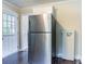 Bright kitchen with stainless steel refrigerator and a view of the back door at 1973 Columbia Dr, Decatur, GA 30032