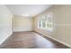 Inviting living space featuring new hardwood floors, neutral paint, and plenty of natural light at 1973 Columbia Dr, Decatur, GA 30032