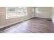 Bright living room with fresh paint, modern trim, and beautiful hardwood floors at 1973 Columbia Dr, Decatur, GA 30032