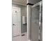 Bathroom featuring a glass shower door and black and white tiled floors at 2112 Fisher Ne Trl, Atlanta, GA 30345