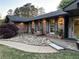 Beautiful red brick home featuring a well-maintained lawn and decorative rock landscaping at 2112 Fisher Ne Trl, Atlanta, GA 30345