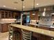 Eat-in kitchen featuring granite countertops, a breakfast bar, and views into the adjoining living space at 2112 Fisher Ne Trl, Atlanta, GA 30345