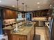 Spacious kitchen features granite countertops, stainless steel appliances, and custom wood cabinetry at 2112 Fisher Ne Trl, Atlanta, GA 30345