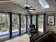 Bright sunroom with skylights, tile floors, and a view of the pool at 2112 Fisher Ne Trl, Atlanta, GA 30345