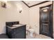 Small half bath with a unique cabinet and black hardware plus white vertical shiplap walls at 24 Laurel Ne Way, White, GA 30184