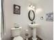Quaint powder room with unique fixtures including pedestal sink and vintage-inspired decor at 24 Laurel Ne Way, White, GA 30184