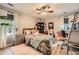 This bedroom has a ceiling fan, window with curtains, and a cute Hello Kitty theme at 24 Laurel Ne Way, White, GA 30184