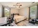 Cozy bedroom with neutral walls, two windows, and modern desk workspace at 24 Laurel Ne Way, White, GA 30184