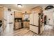 Charming kitchen featuring wood cabinets, stainless steel appliances, and durable wood-look flooring at 24 Laurel Ne Way, White, GA 30184