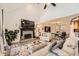 Spacious living room with a stone fireplace, open floor plan, and ample natural light at 24 Laurel Ne Way, White, GA 30184