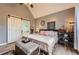Spacious main bedroom with sliding barn door, ensuite bathroom, and modern decor at 24 Laurel Ne Way, White, GA 30184