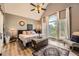 Bright main bedroom featuring vaulted ceilings, a large window, and stylish modern decor at 24 Laurel Ne Way, White, GA 30184