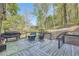 Back deck has lots of seating and a beautiful view of the trees in the back yard at 24 Laurel Ne Way, White, GA 30184