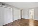 Bedroom with hardwood flooring includes double closets and ensuite access at 3091 Colonial Way # F2, Atlanta, GA 30341