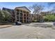 A multi-story condominium complex showcases classic architectural design and ample parking at 3091 Colonial Way # F2, Atlanta, GA 30341