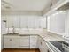 A well-lit kitchen with bright white cabinets, stainless steel appliances, and granite countertops at 3091 Colonial Way # F2, Atlanta, GA 30341