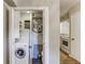 Convenient laundry closet features space saving washer and storage at 3091 Colonial Way # F2, Atlanta, GA 30341