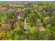 Aerial view of properties nestled within a neighborhood surrounded by a forest at 7275 Oswego Trl, Riverdale, GA 30296