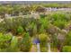 Aerial shot of home surrounded by mature trees at 7275 Oswego Trl, Riverdale, GA 30296
