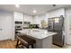 Modern kitchen with stainless steel appliances, granite countertops, and a breakfast bar island at 7275 Oswego Trl, Riverdale, GA 30296