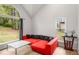 Cozy living room area with a large window, lots of natural light, and stylish decor at 7275 Oswego Trl, Riverdale, GA 30296