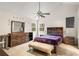 Bedroom featuring wood furniture, a ceiling fan, and a light colored carpet at 7275 Oswego Trl, Riverdale, GA 30296
