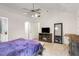 Spacious primary bedroom featuring a fan and an entertainment center at 7275 Oswego Trl, Riverdale, GA 30296