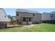 Spacious backyard featuring a wooden deck and a screened-in porch at 225 Mary Jane Ln, Covington, GA 30016