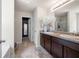 Bathroom with double vanity, dark wood cabinets and a large mirror at 225 Mary Jane Ln, Covington, GA 30016