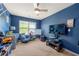 Inviting bedroom featuring creative wall design, ceiling fan, window, and play area at 225 Mary Jane Ln, Covington, GA 30016