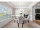 Formal dining room featuring crown molding, chandelier, and a large window at 225 Mary Jane Ln, Covington, GA 30016