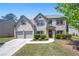Charming two-story brick home with a well-manicured front yard at 225 Mary Jane Ln, Covington, GA 30016