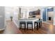 Bright kitchen featuring granite countertops, stainless steel appliances, and bar seating at 225 Mary Jane Ln, Covington, GA 30016